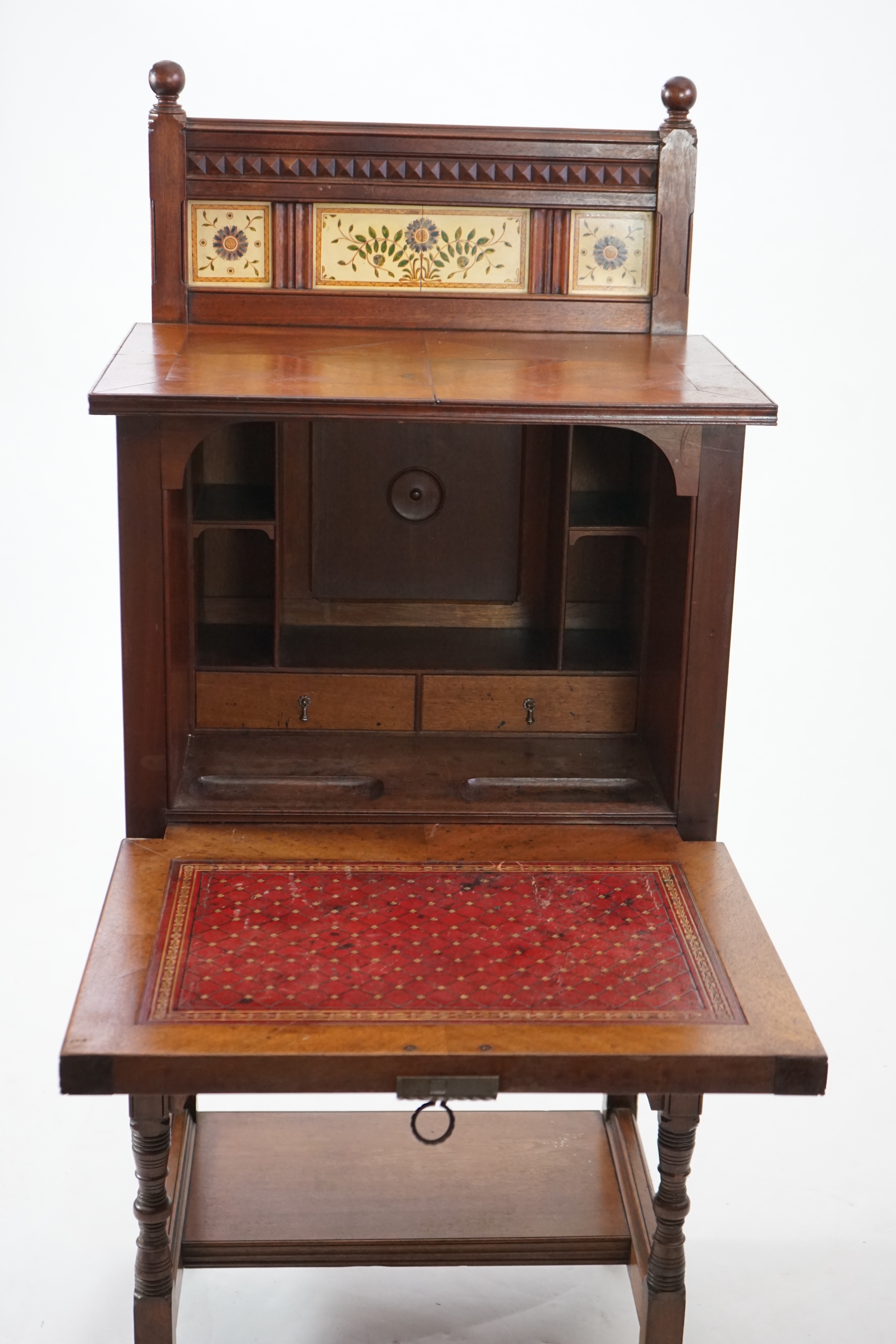 A Victorian Aesthetic Period walnut fall front desk attributed to Bruce James Talbert (1838-1881)